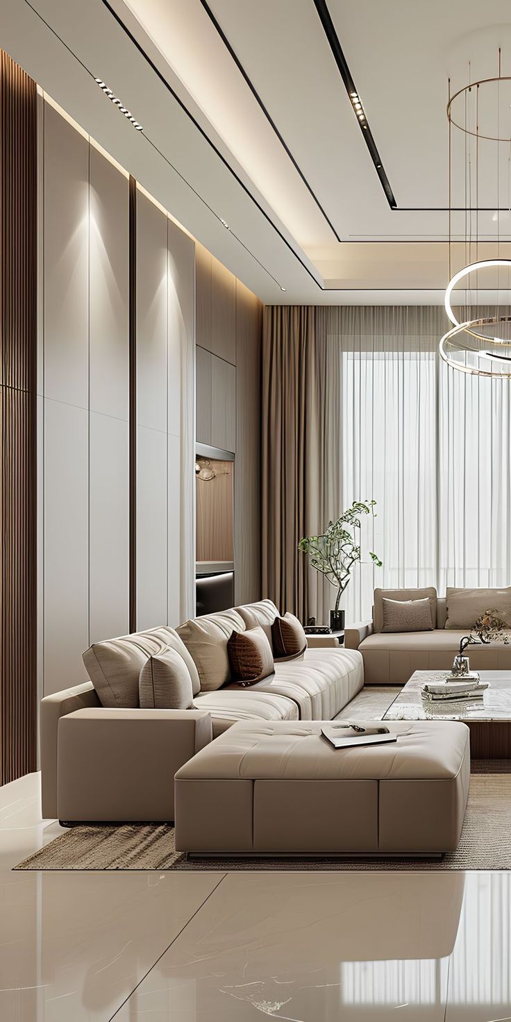 Stepped gypsum ceiling with lit edges above panelled walls and a ring chandelier