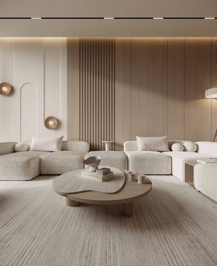 Fluted wood panels and arch relief behind a sofa, with a lit ceiling edge